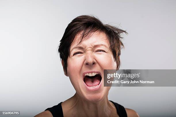 woman shouting - aggressive stock pictures, royalty-free photos & images