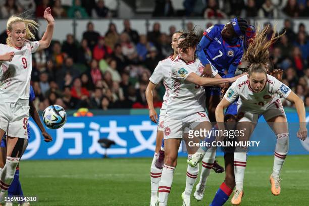 Denmark's midfielder Janni Thomsen , Haiti's forward Batcheba Louis and Denmark's defender Simone Boye Sorensen fight for the ball next to Denmark's...