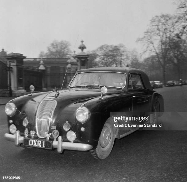 Prince Philip driving his Aston Martin Lagonda car to Buckingham Palace where Queen Elizabeth II is due to give birth to the couple's third child,...