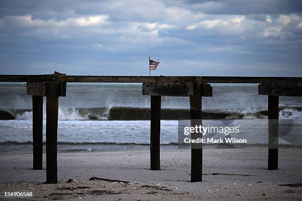 An American flag is attached to the boarwalk damaged by Superstorm Sandy, on November 24, 2012 in Ortley Beach, New Jersey. New Jersey Gov. Christie...