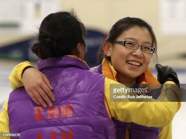 Bingyu Wang and Yin Liu of China celebrate their victory over Japan during the Pacific Asia 2012 Curling Championship at the Naseby Indoor Curling...