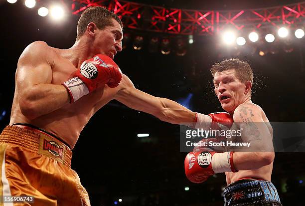 Ricky Hatton of Great Britain is caught by Vyacheslav Senchenko of Ukraine during their Welterweight bout at the MEN Arena on November 24, 2012 in...