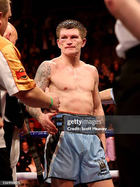 Ricky Hatton of Great Britain looks dejected after defeat to Vyacheslav Senchenko of Ukraine during their Welterweight bout at the MEN Arena on...