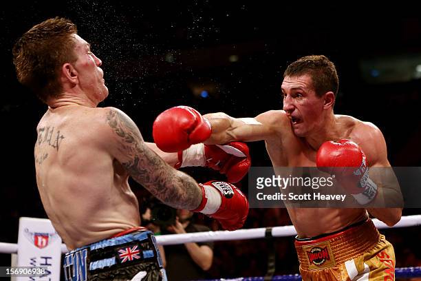 Ricky Hatton of Great Britain is caught by Vyacheslav Senchenko of Ukraine during their Welterweight bout at the MEN Arena on November 24, 2012 in...