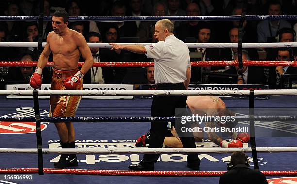 Vyacheslav Senchenko of Ukraine is sent to the corner by the referee after knocking down Ricky Hatton of Great Britain during their welterweight bout...