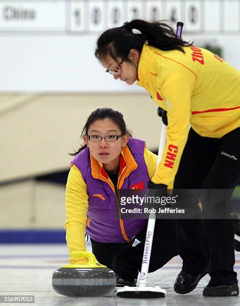 Bingyu Wang of China is all concentration during the Pacific Asia 2012 Curling Championship at the Naseby Indoor Curling Arena on November 25, 2012...