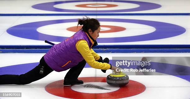 Qingshuang Yue of China in action during the Pacific Asia 2012 Curling Championship at the Naseby Indoor Curling Arena on November 25, 2012 in...