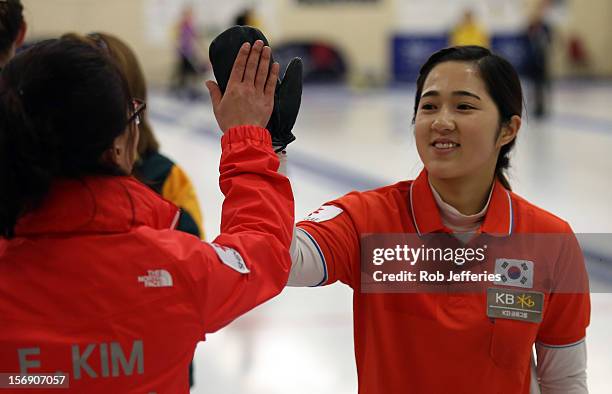 Kyeong-Ae Kim and Eun-Jung Kim of Korea celebrate their win over Australia to claim third at the Pacific Asia 2012 Curling Championship at the Naseby...