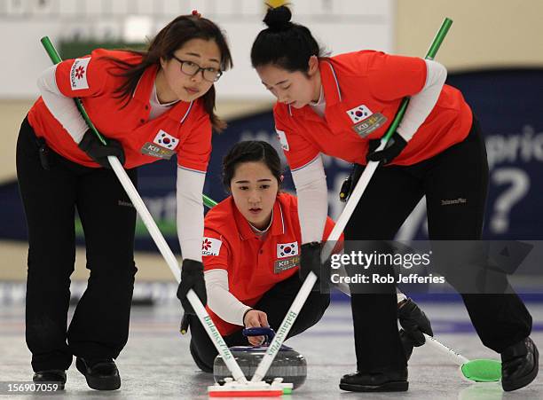 Kyeong-Ae Kim of Korea delivers her stone during the Pacific Asia 2012 Curling Championship at the Naseby Indoor Curling Arena on November 25, 2012...