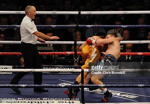 Ricky Hatton of Great Britain and Vyacheslav Senchenko of Ukraine fall to the canvas during their welterweight bout at MEN Arena on November 24, 2012...