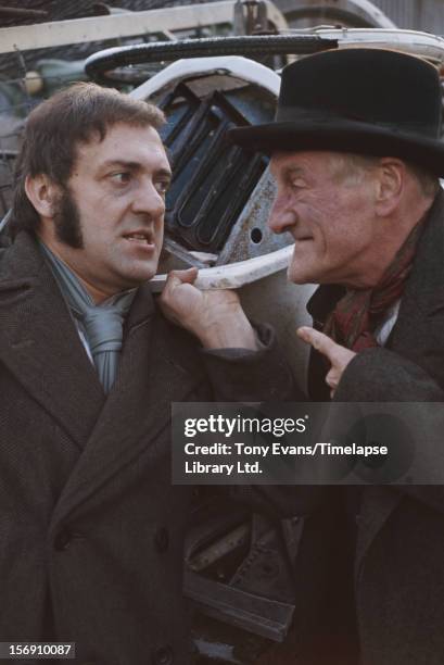 Actors Harry H Corbett and Wilfrid Brambell as they appear in the BBC sitcom 'Steptoe and Son', circa 1970.