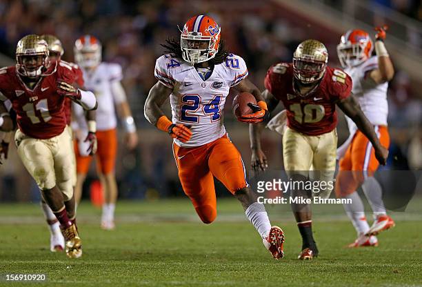 Matt Jones of the Florida Gators rushes for a touchdown during a game against the Florida State Seminoles at Doak Campbell Stadium on November 24,...