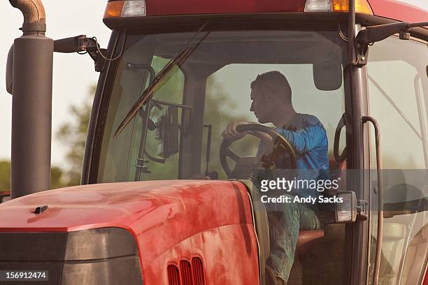 cu of farmer in tractor cab, guided by gps. - automatisiertes fahren stock-fotos und bilder