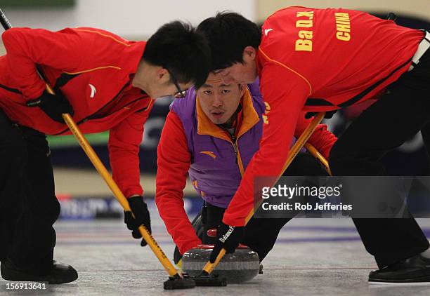 Rui Liu of China delivers his stone during the Pacific Asia 2012 Curling Championship at the Naseby Indoor Curling Arena on November 25, 2012 in...