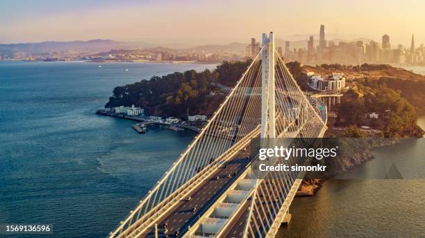 view of san francisco-oakland bay bridge - san francisco oakland bay bridge stock pictures, royalty-free photos & images