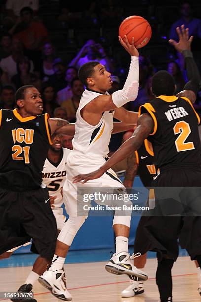 Phil Pressey of the Missouri Tigers shoots against Briante Weber of the Virgina Commonwealth Rams during the Battle 4 Atlantis tournament at Atlantis...