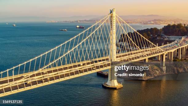 blick auf die san francisco-oakland bay bridge - bay bridge stock-fotos und bilder