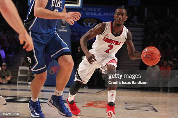 Russ Smith of the Louisville Cardinals passes against the Duke Blue Devils during the Battle 4 Atlantis tournament at Atlantis Resort November 24,...