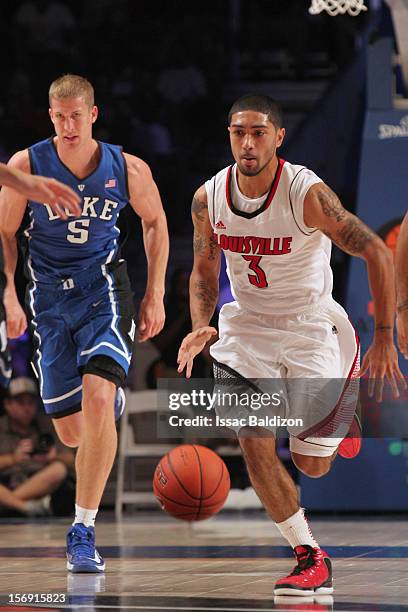 Peyton Siva of the Louisville Cardinals dribbles up court against the Duke Blue Devils during the Battle 4 Atlantis tournament at Atlantis Resort...