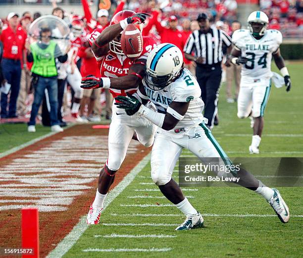 Ryan Jackson of the Houston Cougars dives for the endzone as Darion Monroe of the Tulane Green Wave knocks him out of bounds at Robertson Stadium on...