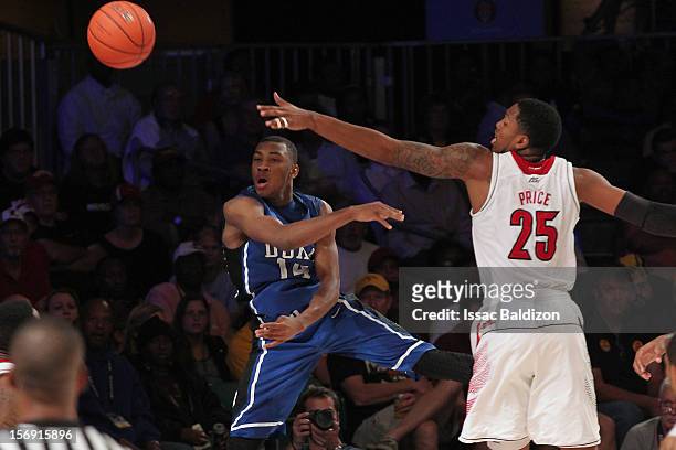 Rasheed Sulaimon of the Duke Blue Devils passes against Zach Price of the Louisville Cardinals during the Battle 4 Atlantis tournament at Atlantis...