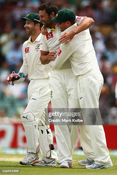 Ben Hilfenhaus of Australia celebrates with Michael Clarke of Australia after taking the wicket of Graeme Smith of South Africa during day four of...