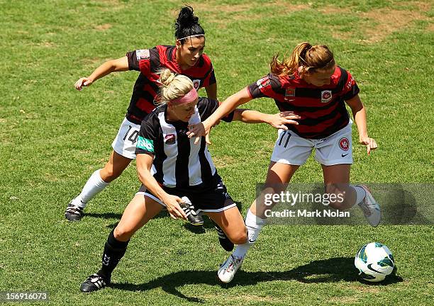 Trudy Camilleri and Louise Fors of the Wanderers contest possession with Tiffany Boshers of the Jets during the round six W-League match between the...