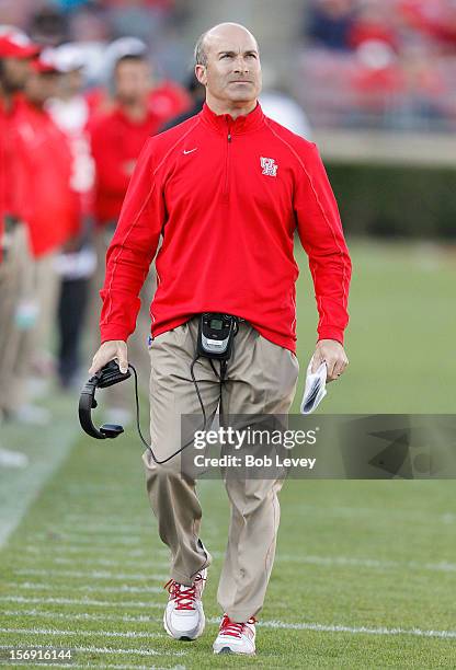 Houston Cougars head coach Tony Levine checks the scoreboard at Robertson Stadium on November 24, 2012 in Houston, Texas. Houston defeats Tulane...