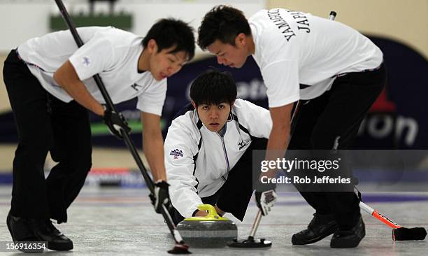 Yusuke Morozumi of Japan watches his stone intently during the Pacific Asia 2012 Curling Championship at the Naseby Indoor Curling Arena on November...