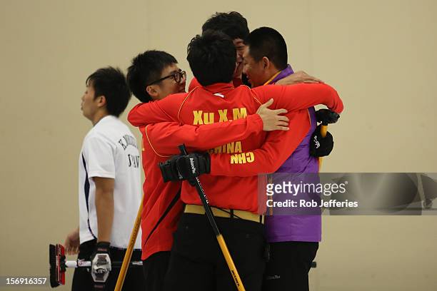 The China team of Rui Liu, Xiaoming Xu, Jialiang Zang and Dexin Ba celebrate their win over Japan during the Pacific Asia 2012 Curling Championship...