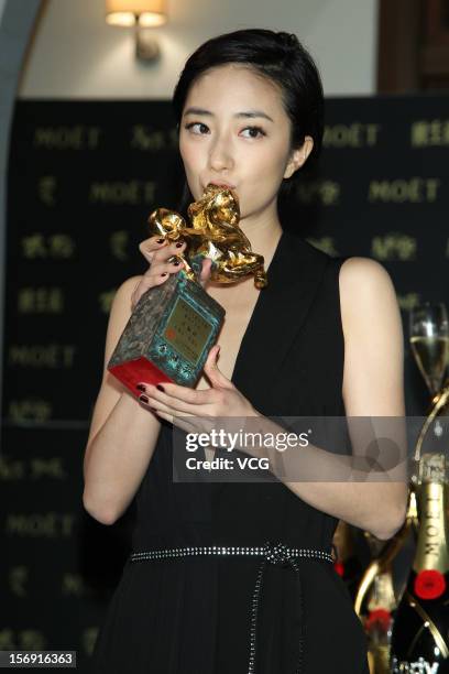 Actress Kwai Lun-Mei poses with her trophy during a celebration after the 49th Golden Horse Awards on November 24, 2012 in Ilan, Taiwan.