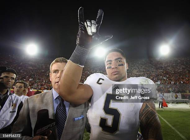 Linebacker Manti Te'o of the Notre Dame Fighting Irish celebrates his teams 22-13 victory over the USC Trojans at Los Angeles Memorial Coliseum on...