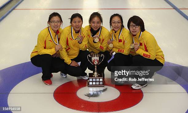 The winning China team of Bingyu Wang, Yin Liu, Qingshuang Yue, Yan Zhou and Jinli Liu pose for a photo at the Pacific Asia 2012 Curling Championship...