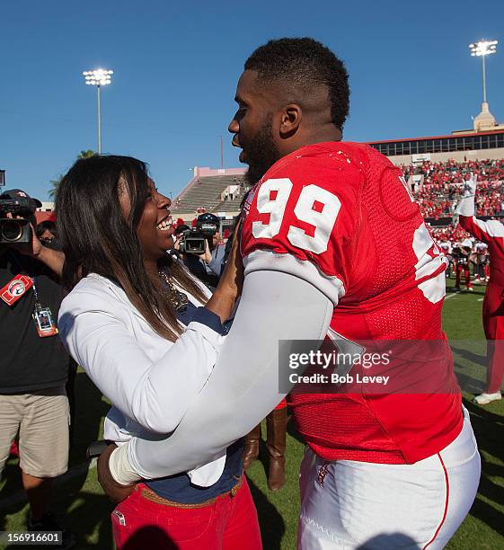 Dominic Miller of the Houston Cougars proposes to his girlfriend during pre-game ceremonies against the Tulane Green Wave at Robertson Stadium on...