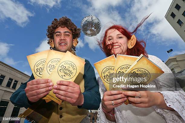 Wellington i-SITE Visitor Information Centre staff Nick Jones and Lauren Campbell pose with 'Middle Earth' brochures ahead of the "The Hobbit: An...