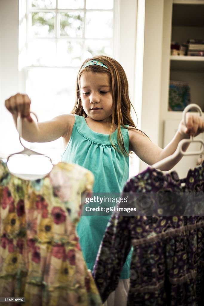 Girl (6yrs) looking at which dress to wear