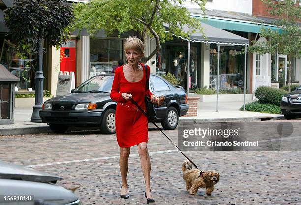 Sally Forthuber walks her dog Abbey along Park Ave. In Winter Park, Florida. Thursday, September 20, 2012. Sally and her husband of 31 years, Ray...