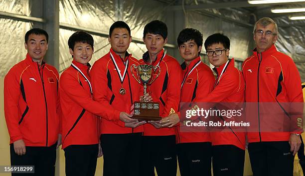 The China team of Rui Liu, Xiaoming Xu, Jialiang Zang, Dexin Ba and Dejia Zou pose for a photo during the Pacific Asia 2012 Curling Championship at...