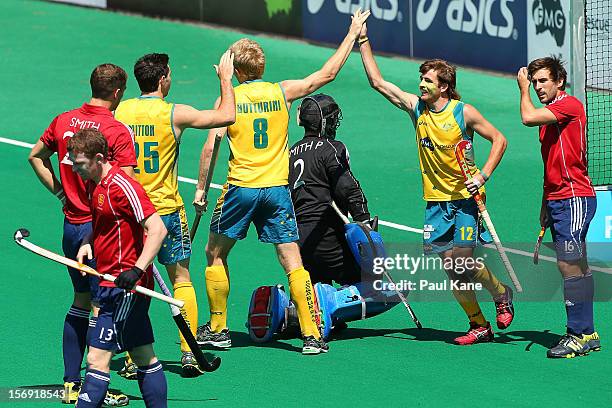 Matthew Butturini and Jacob Whetton of the Kookaburras celebrate a goal in the gold medal match between the Australian Kookaburras and England during...