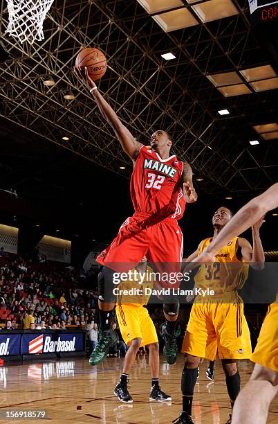 Kris Joseph of the Maine Red Claws lays in the shot against D'Aundray Brown of the Canton Charge at the Canton Memorial Civic Center on November 23,...