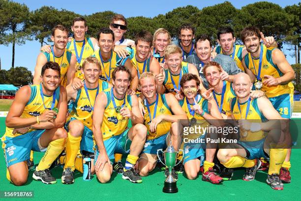 The Kookaburras pose with the trophy after winning the gold medal match between the Australian Kookaburras and England during day four of the 2012...