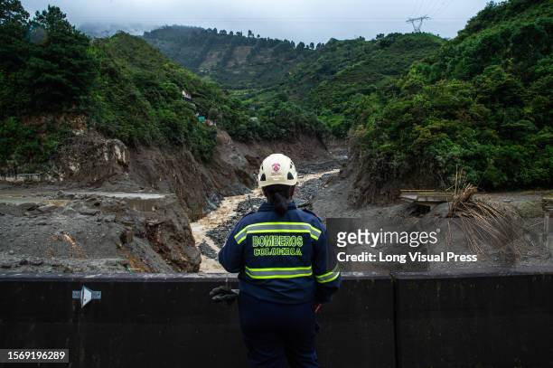 Firefighter oversees the disaster caused by the landslide in Quetame, Cundinamarca, as Colombia now confirms the death of 26 and 3 still missing, on...