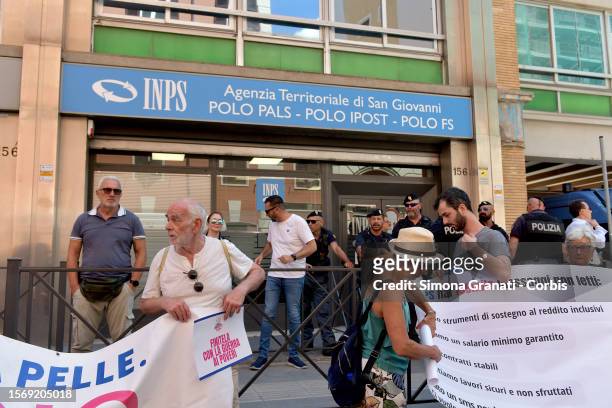 People protesting in front of the INPS offices with placards reading "End it with the war on the poor", against the government's decision to abolish...