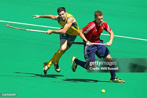 Richard Smith of England fends off Trent Mitton of the Kookaburras in the Australia v England final during day four of the 2012 International Super...