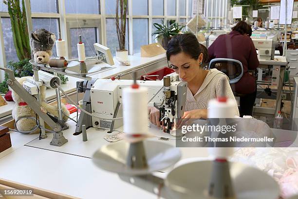 Worker sews at the Steiff stuffed toy factory on November 23, 2012 in Giengen an der Brenz, Germany. Founded by seamstress Margarethe Steiff in 1880,...