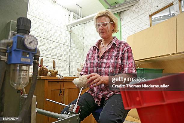 Worker stuffs teddy bears at the Steiff stuffed toy factory on November 23, 2012 in Giengen an der Brenz, Germany. Founded by seamstress Margarethe...