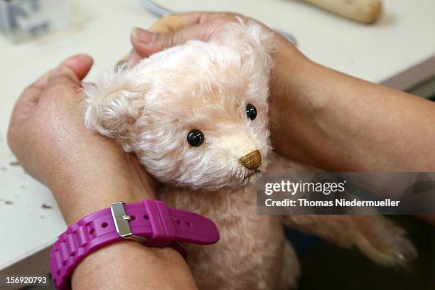 Teddy bear is completed at the Steiff stuffed toy factory on November 23, 2012 in Giengen an der Brenz, Germany. Founded by seamstress Margarethe...