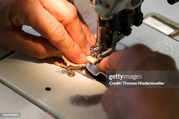 Worker sews fabric at the Steiff stuffed toy factory on November 23, 2012 in Giengen an der Brenz, Germany. Founded by seamstress Margarethe Steiff...