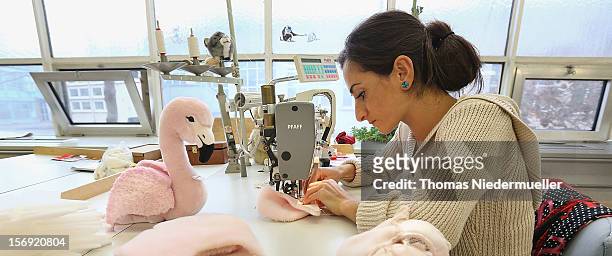 Worker sews stuffed swans together at the Steiff toy factory on November 23, 2012 in Giengen an der Brenz, Germany. Founded by seamstress Margarethe...