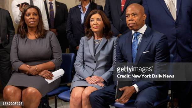united-states-july-31-mayor-eric-adams-seated-next-to-new-york-governor-kathy-hochul-and-ny.jpg